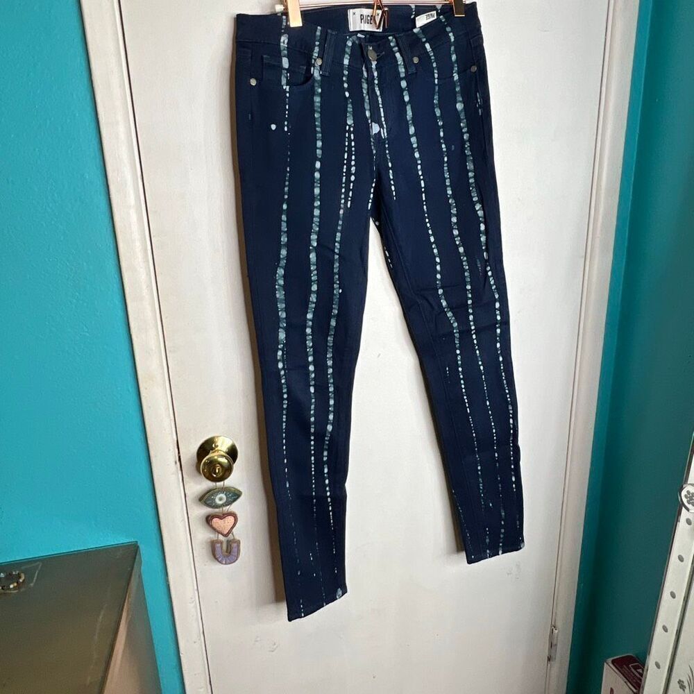 These are Paige Verdugo Ultra Skinny blue denim jeans with a stylish batik patte